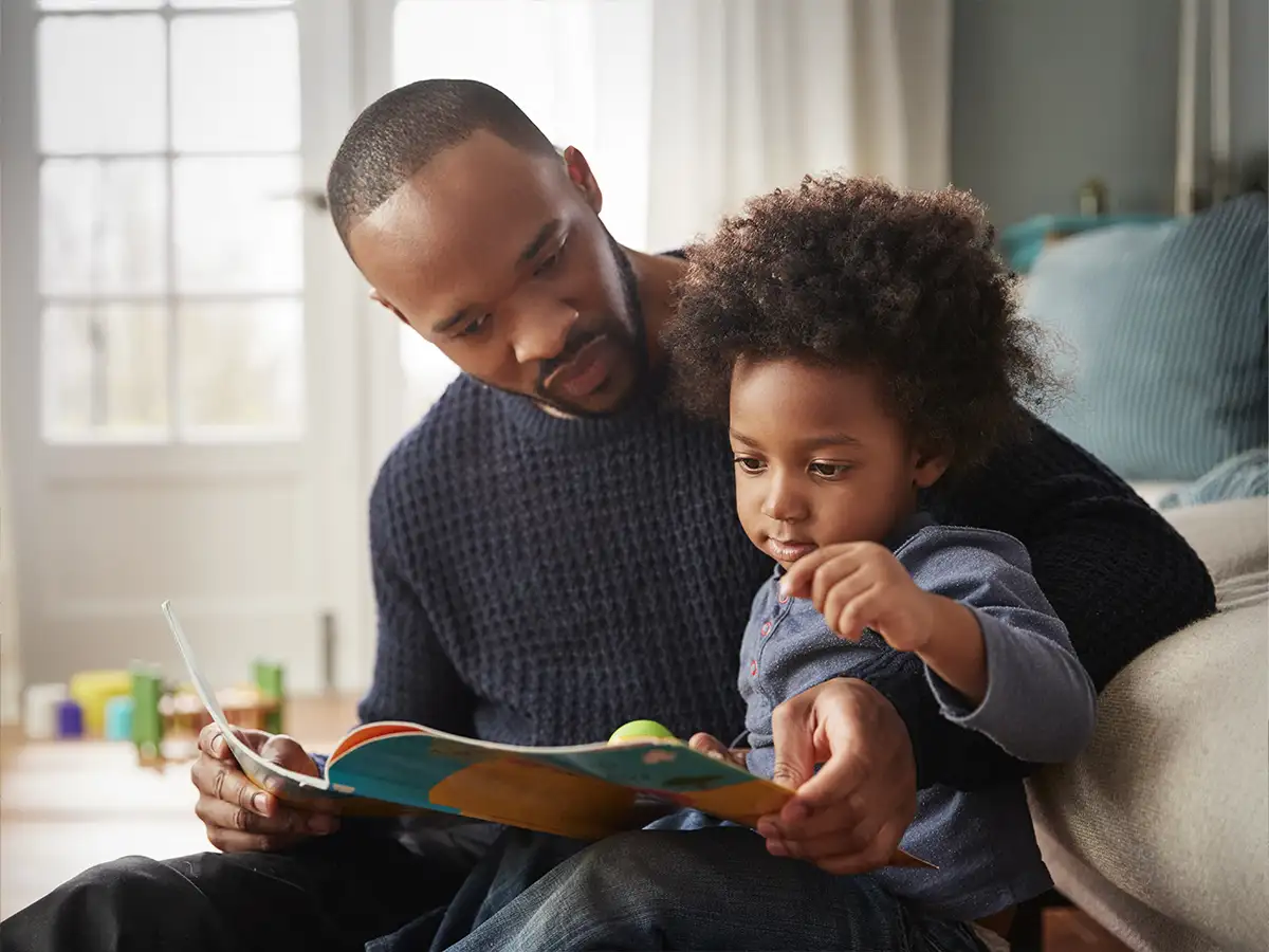 A father reading to his todder son